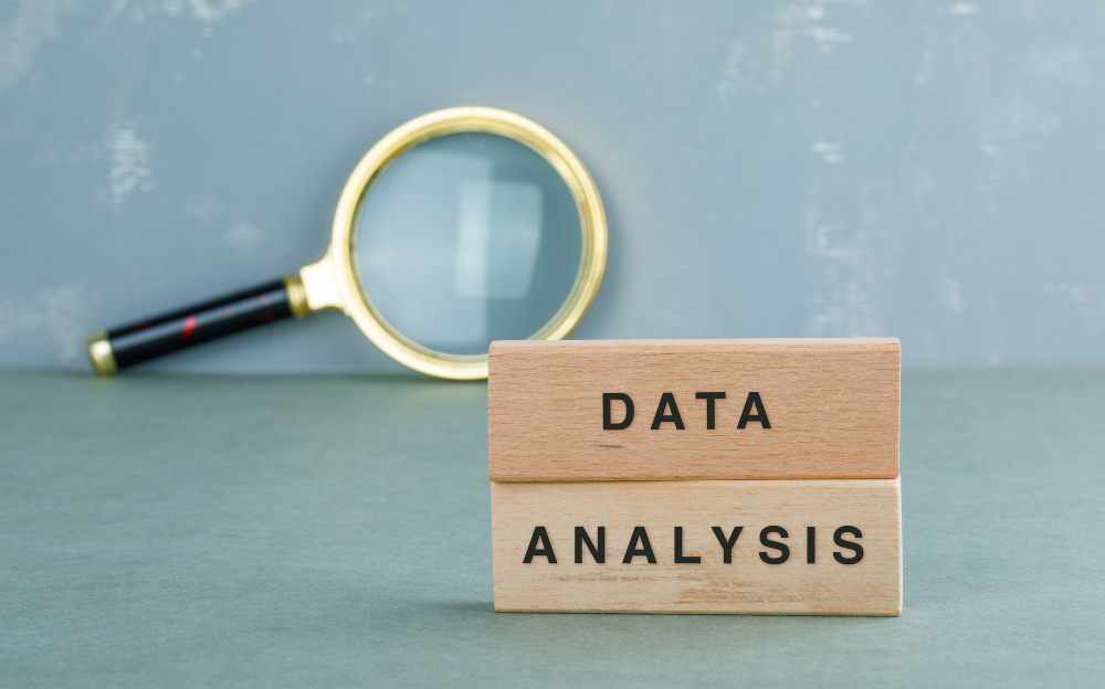 conceptual-data-analysis-with-wooden-blocks-magnifying-glass-side-view