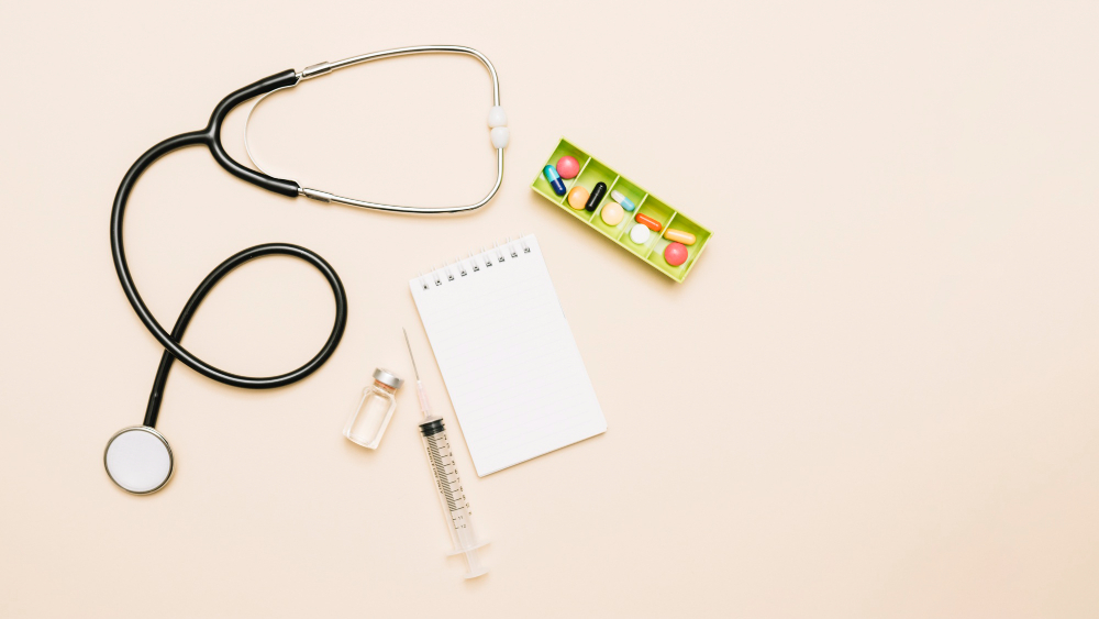 notepad-near-stethoscope-medications